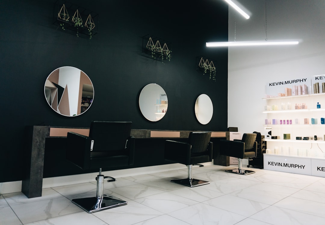 bright modern salon interior with styling chairs and large mirrors in soft natural light